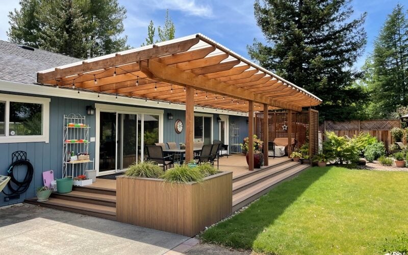 A view of the modern deck with ornamental grasses